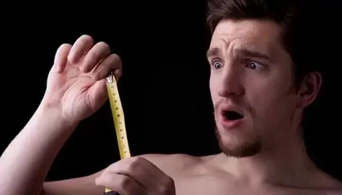 Man measuring his penis before enlargement