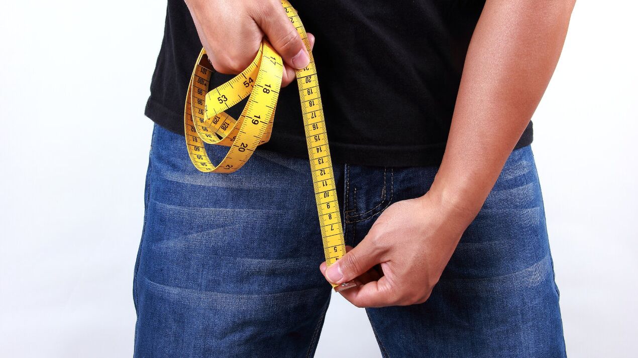 Man measures penis before enlargement